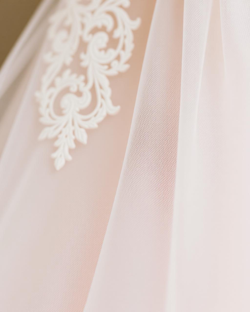 Close-up of lace and tulle wedding gown fabric